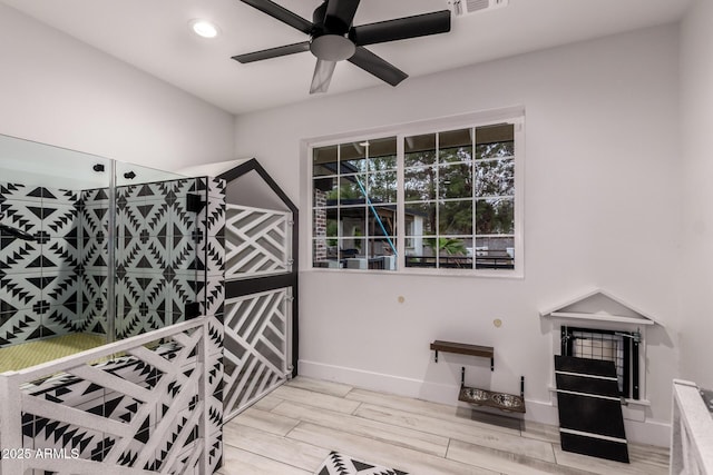bedroom featuring visible vents, baseboards, recessed lighting, a ceiling fan, and wood tiled floor