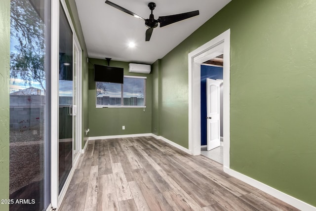 unfurnished sunroom featuring an AC wall unit