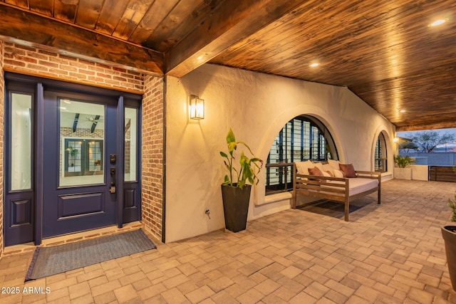 property entrance with a patio area