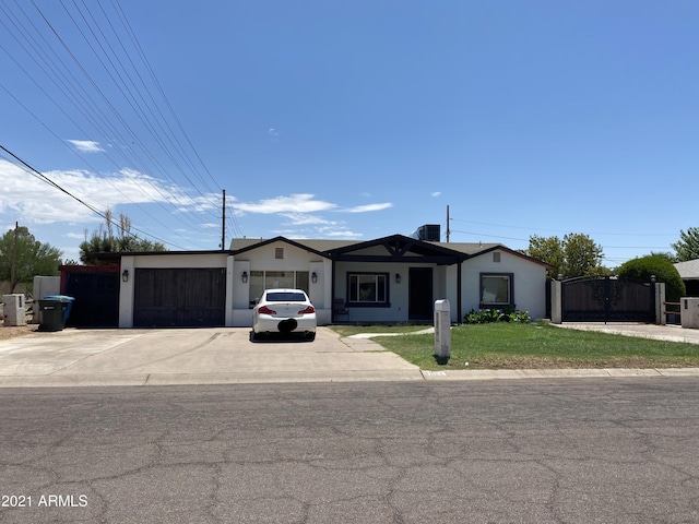 single story home featuring a garage