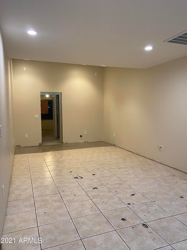 empty room featuring light tile floors