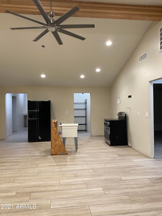 sitting room with beamed ceiling, high vaulted ceiling, and ceiling fan