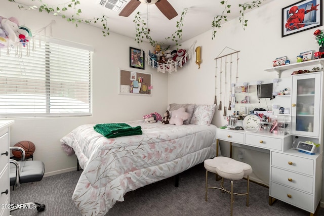 2223 S Hughes Dr, Buckeye, AZ 85326 - bedroom with multiple windows, carpet, baseboards, and a ceiling fan