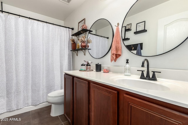 2223 S Hughes Dr, Buckeye, AZ 85326 - full bath with toilet, vanity, tile patterned floors, and curtained shower