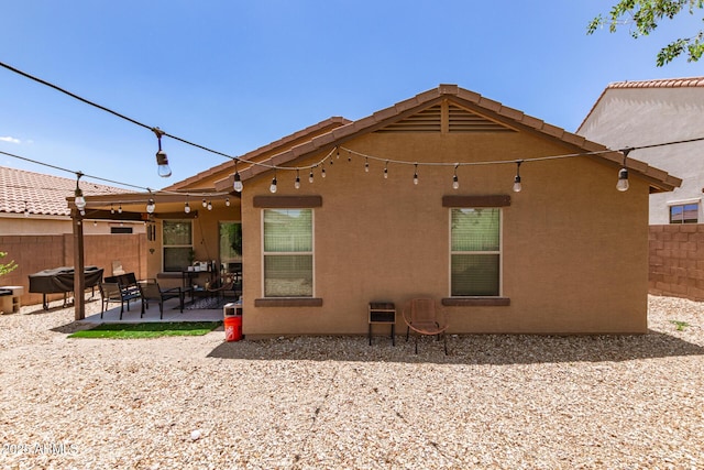 2223 S Hughes Dr, Buckeye, AZ 85326 - back of property with a patio and stucco siding
