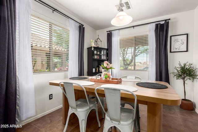 2223 S Hughes Dr, Buckeye, AZ 85326 - dining area featuring plenty of natural light and baseboards
