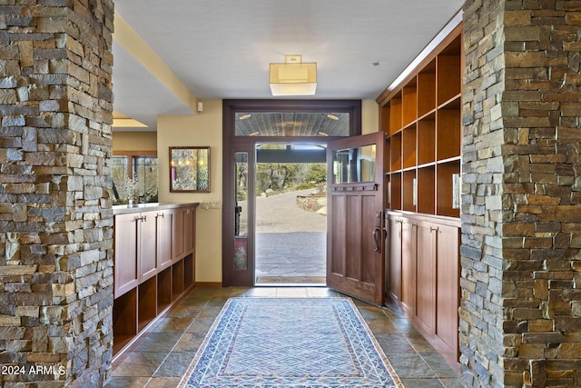 doorway featuring stone tile floors