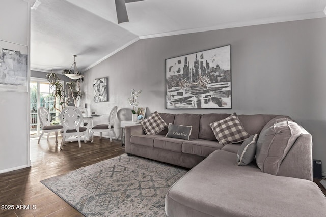 living room featuring lofted ceiling, dark wood-style floors, baseboards, and crown molding