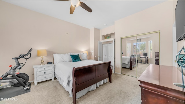 bedroom featuring light carpet, ceiling fan, and baseboards