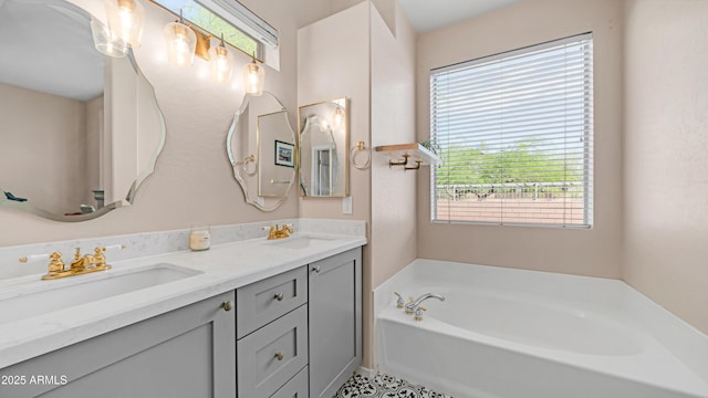 bathroom with a garden tub and double vanity