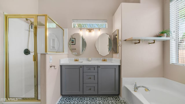 bathroom with a stall shower, plenty of natural light, double vanity, and a bath