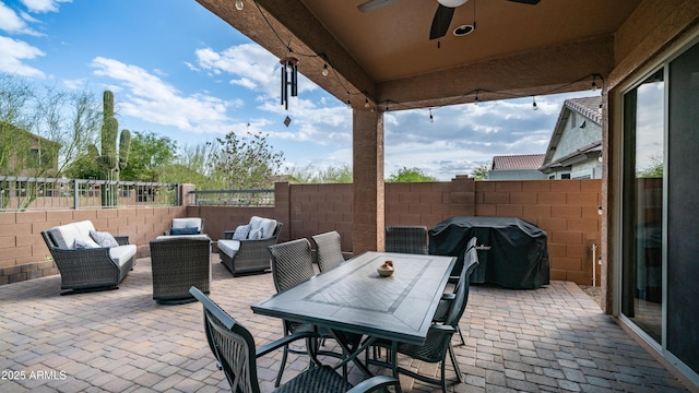 view of patio featuring ceiling fan, a grill, a fenced backyard, and outdoor lounge area