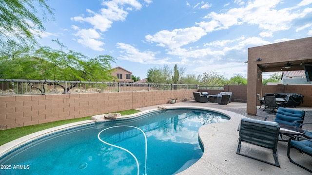 view of pool with a fenced backyard, a patio, an outdoor living space, and ceiling fan