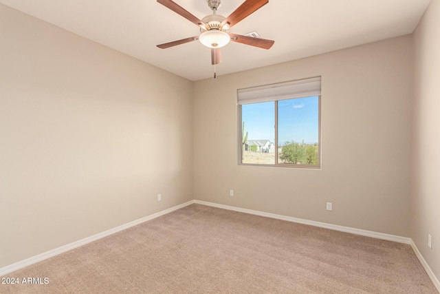 empty room with light carpet and ceiling fan