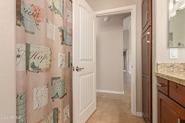 bathroom with tile patterned flooring and vanity