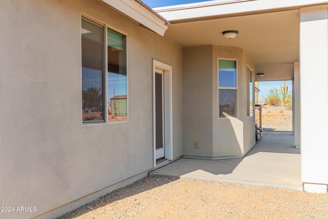 doorway to property featuring a patio area