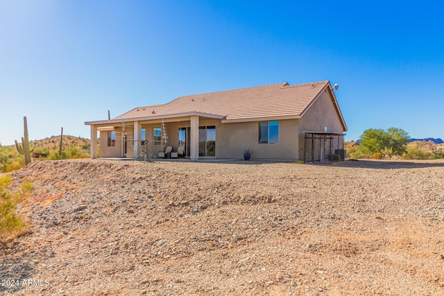 rear view of property with a patio