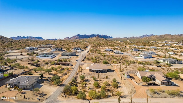 birds eye view of property with a mountain view