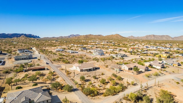 birds eye view of property with a mountain view