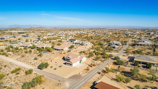 birds eye view of property featuring a mountain view