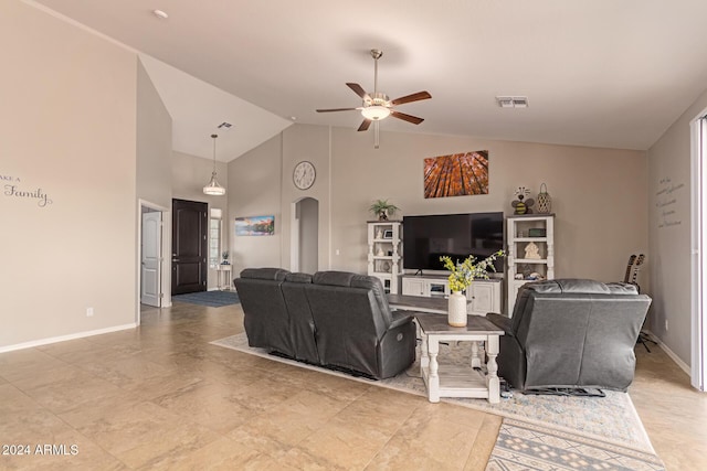 living room featuring ceiling fan and lofted ceiling