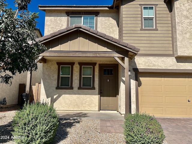 property entrance with a garage