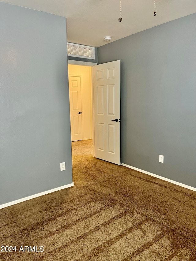 spare room with carpet flooring