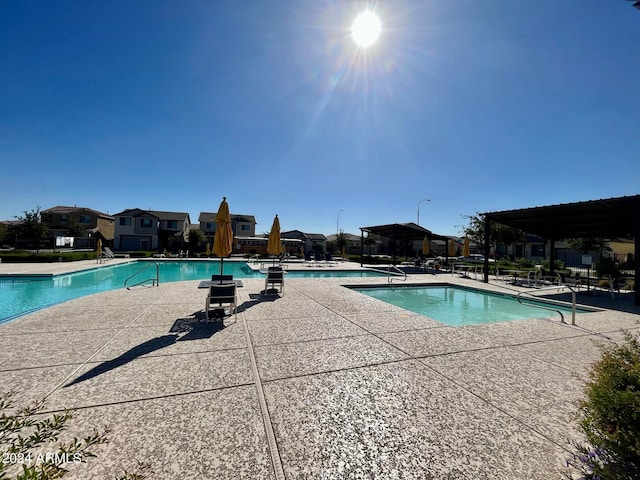 view of swimming pool with a patio