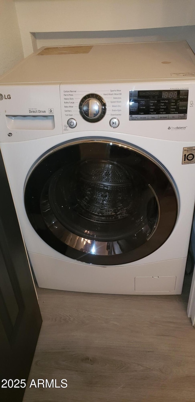 laundry area with washer / clothes dryer and dark hardwood / wood-style floors