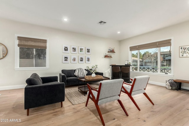 living room with light hardwood / wood-style flooring