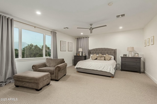 bedroom featuring ceiling fan and light carpet