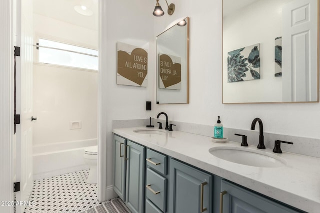 full bathroom with shower / tub combination, vanity, tile patterned floors, and toilet