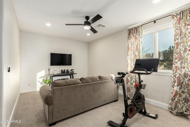 living room with light colored carpet and ceiling fan