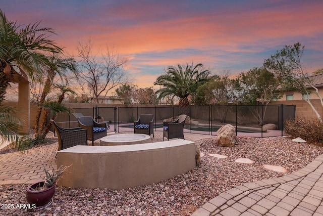 view of patio terrace at dusk