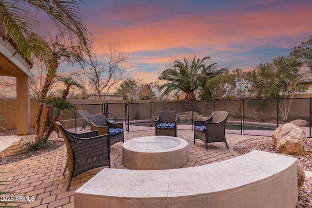 patio terrace at dusk with an outdoor fire pit