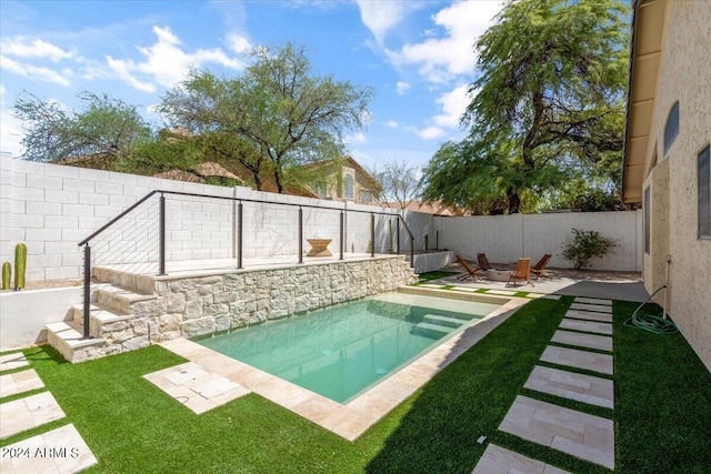 view of swimming pool with a patio area