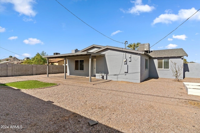 back of property featuring a patio