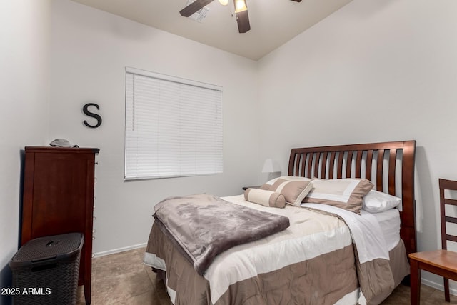 bedroom with a ceiling fan and baseboards