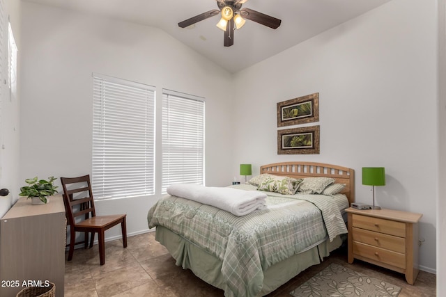 bedroom with baseboards, ceiling fan, and vaulted ceiling