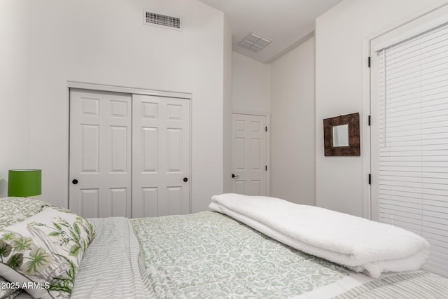 bedroom featuring a closet and visible vents