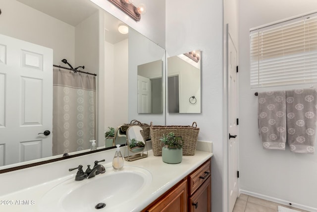 bathroom featuring tile patterned flooring and vanity
