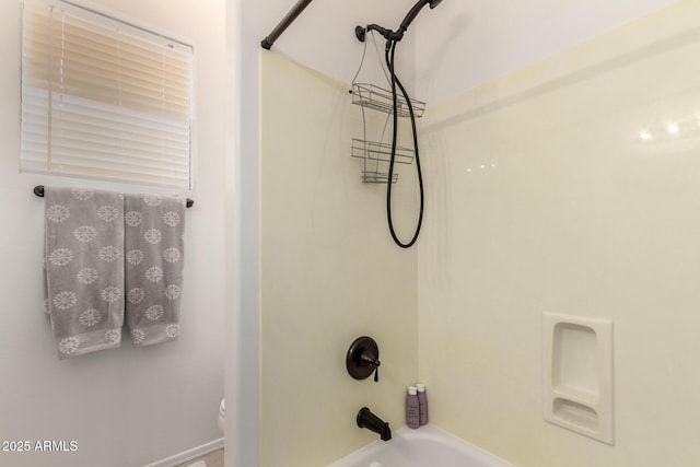 bathroom featuring  shower combination and toilet