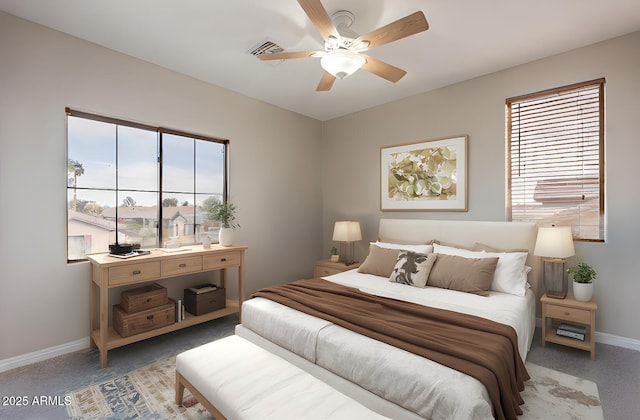 carpeted bedroom featuring multiple windows and ceiling fan