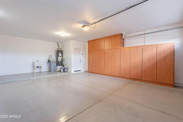 garage featuring water heater and a garage door opener