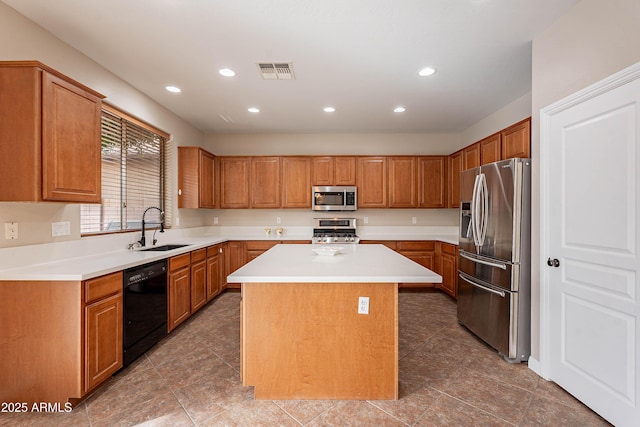 kitchen with a center island, sink, and appliances with stainless steel finishes