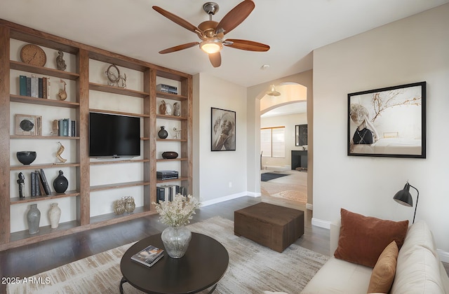 living room featuring hardwood / wood-style flooring and ceiling fan