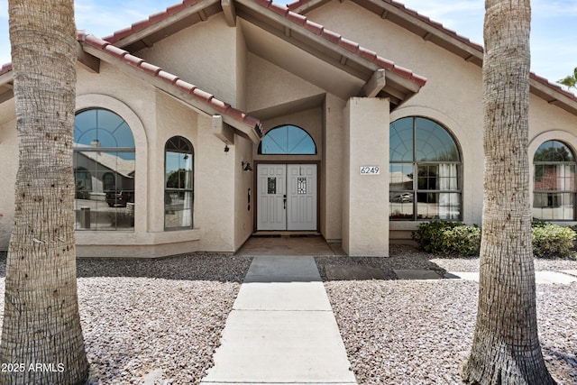 6249 E Camelot Dr, Mesa, AZ 85215 - doorway to property featuring stucco siding and a tiled roof