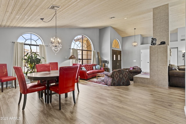 6249 E Camelot Dr, Mesa, AZ 85215 - dining space featuring a chandelier, light wood-type flooring, wooden ceiling, and high vaulted ceiling