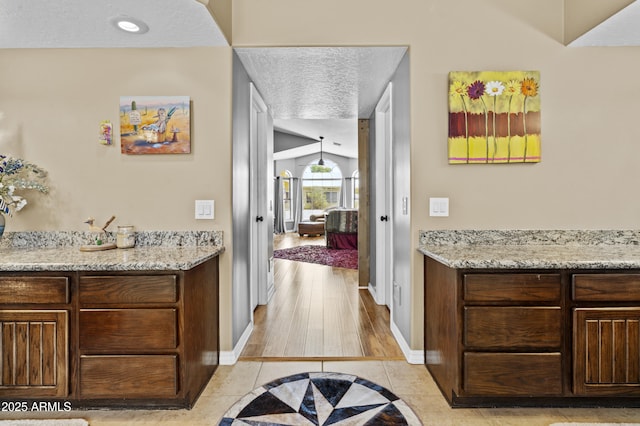 6249 E Camelot Dr, Mesa, AZ 85215 - hallway with a textured ceiling and light tile patterned floors