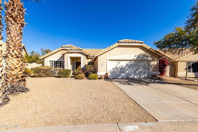 mediterranean / spanish-style home featuring a garage